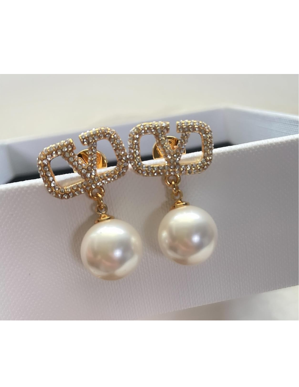 Assorted logo earrings and jewelry sets