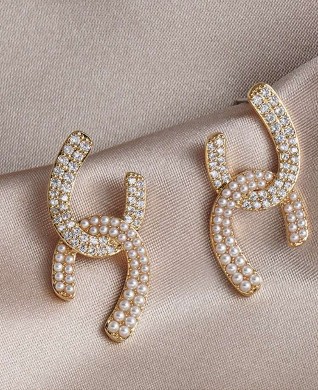 Assorted logo earrings and jewelry sets