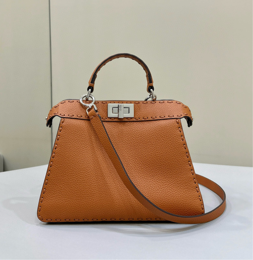 Camel brown colored large peekaboo bag.