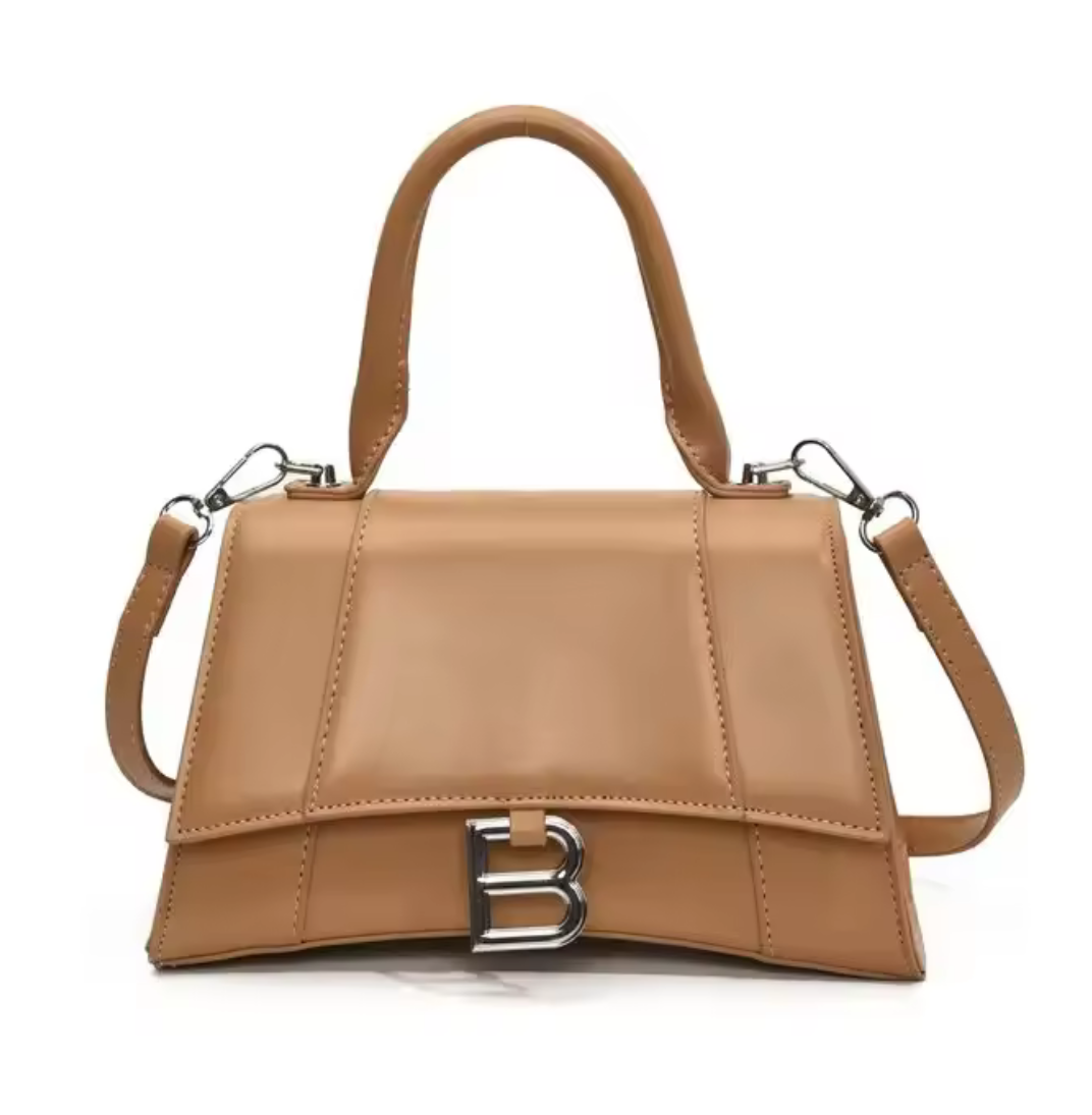 Camel colored solid leather hourglass handbag with solid leather strap & handle, silver hardware & silver letter B logo on the front. (Standard size)