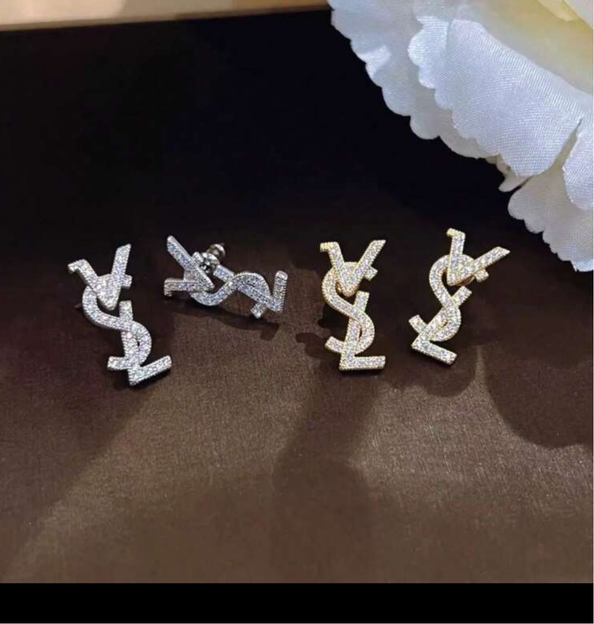 Assorted logo earrings and jewelry sets