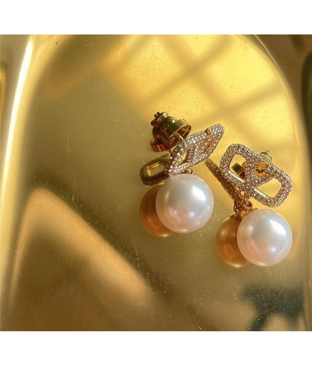 Assorted logo earrings and jewelry sets