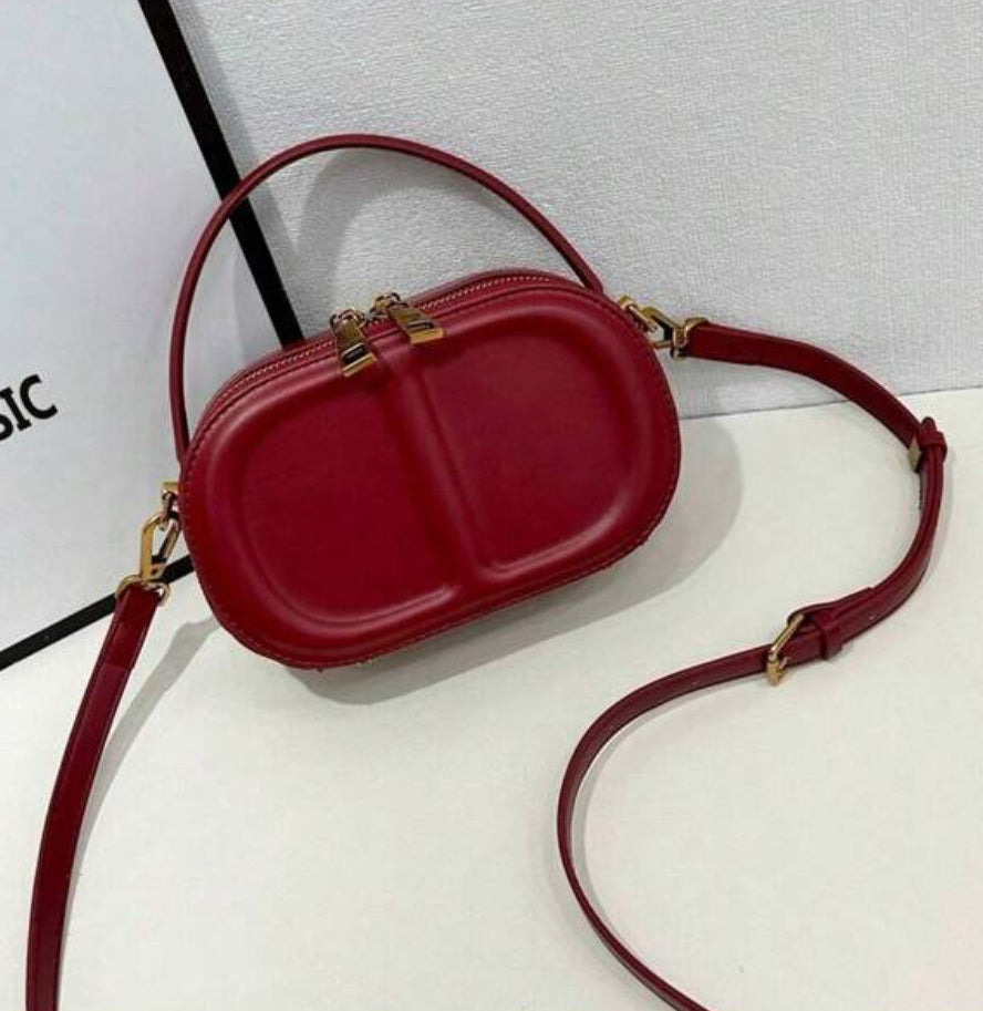 CD letter shapes cross body