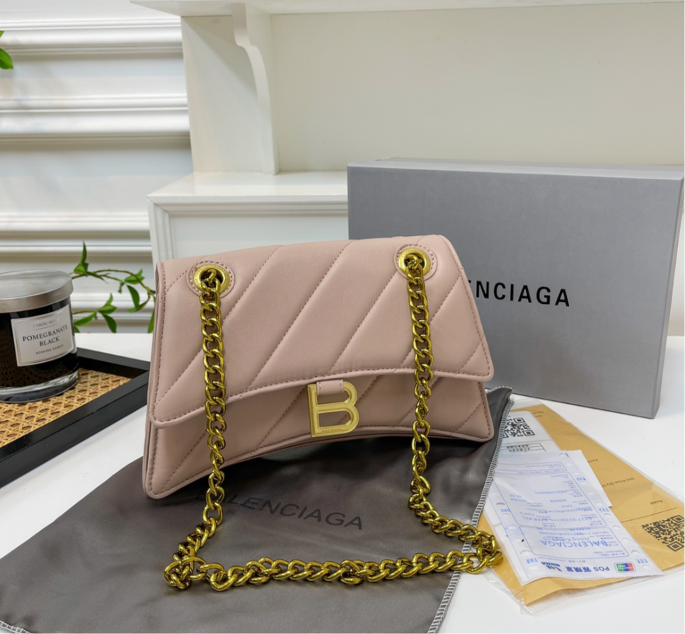 Solid light pink (large) leather hourglass handbag with diagonal lines design, gold hardware including Gold B logo & chain