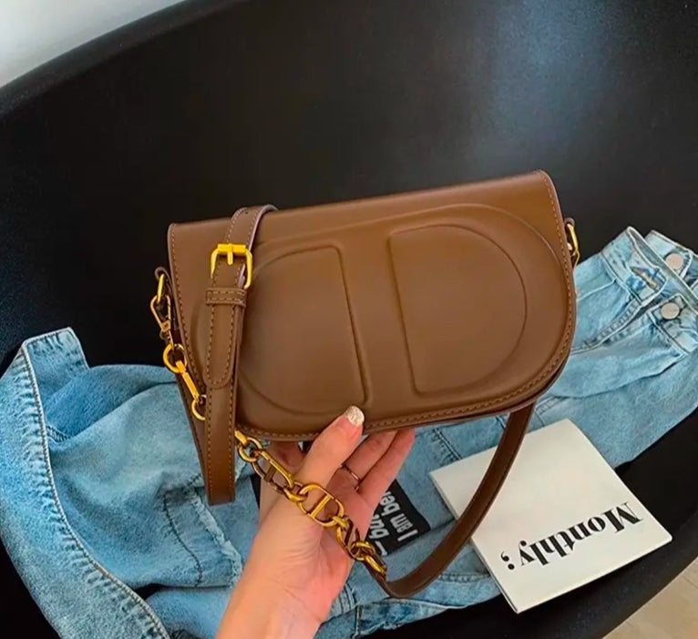 CD letter shapes cross body