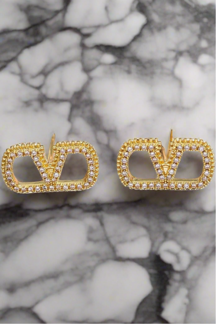 Assorted logo earrings and jewelry sets