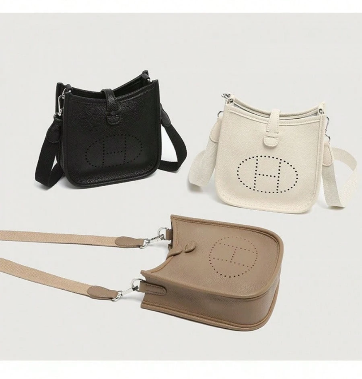 Leather crossbody with hole poke H logo.