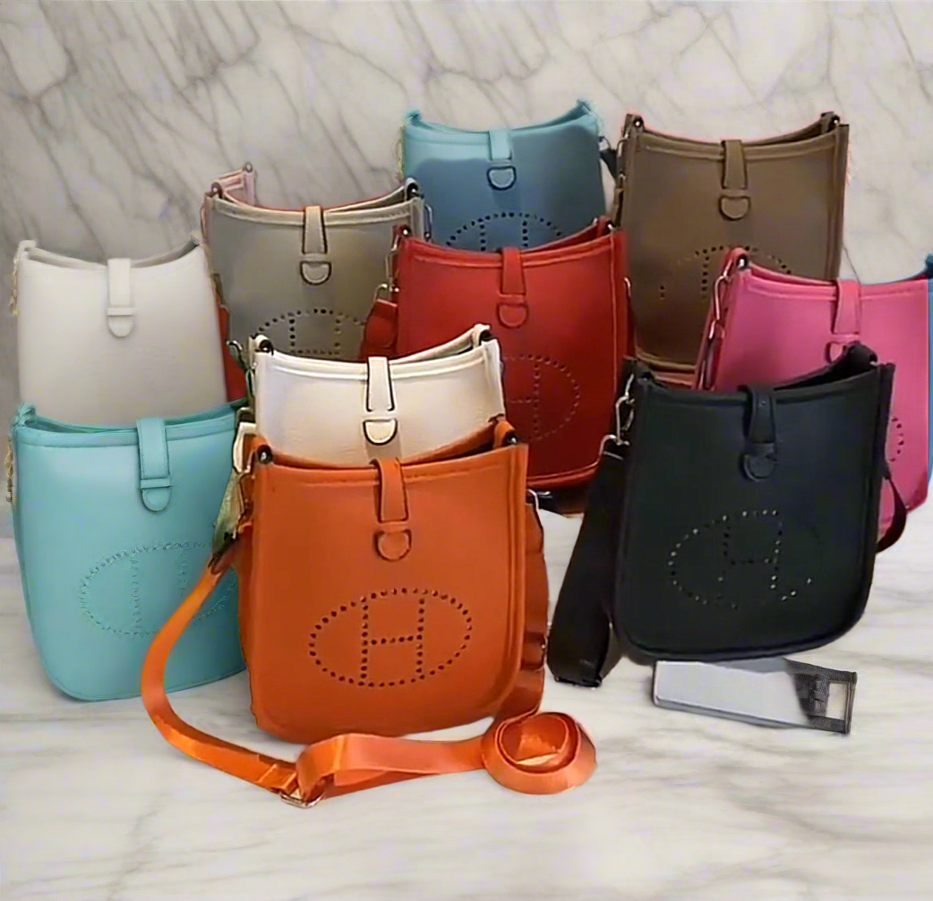 Leather crossbody with hole poke H logo.