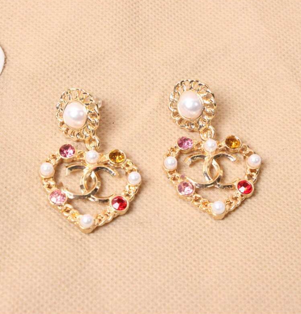 Assorted logo earrings and jewelry sets