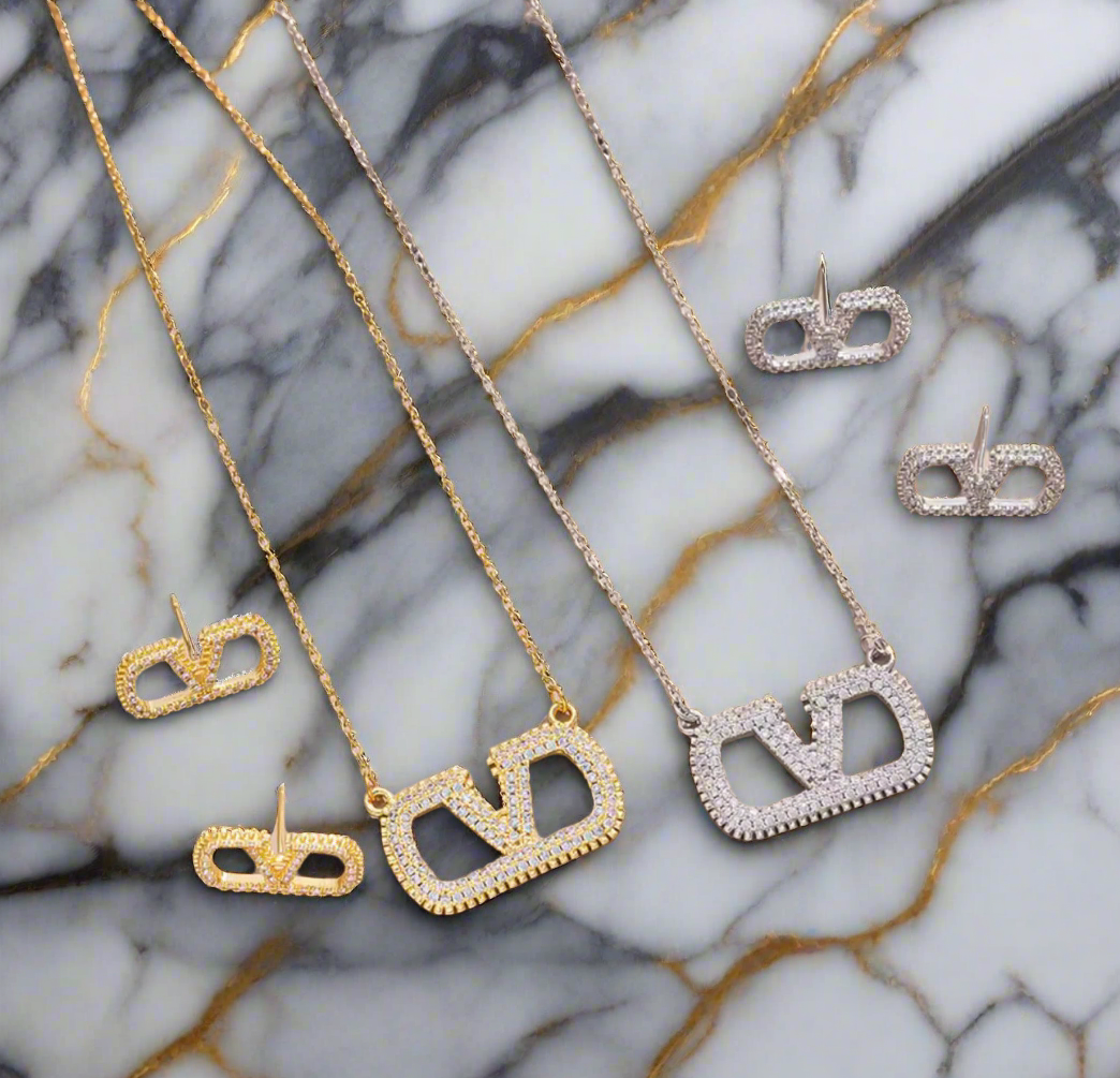Assorted logo earrings and jewelry sets