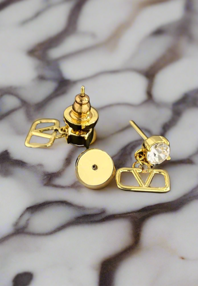 Assorted logo earrings and jewelry sets