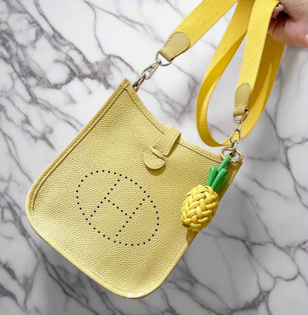 Leather crossbody with hole poke H logo.