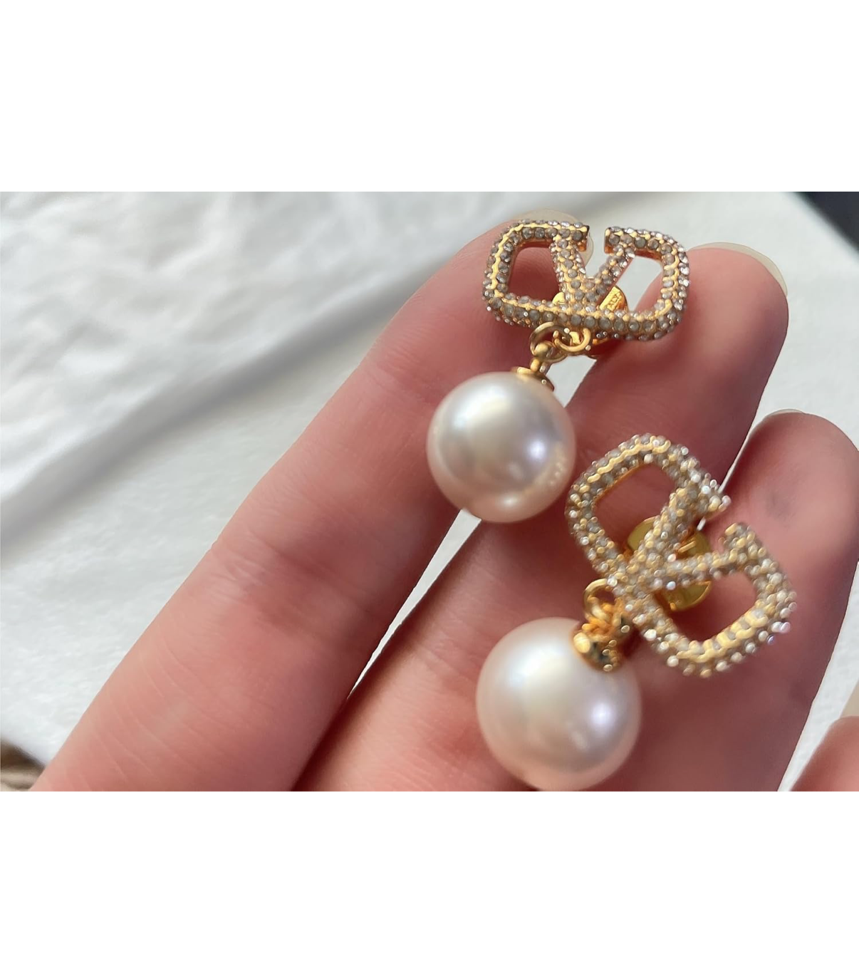 Assorted logo earrings and jewelry sets