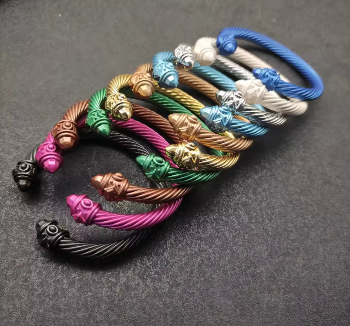 Various colored metal bangle bracelets