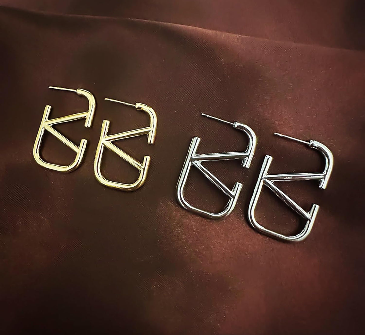 Assorted logo earrings and jewelry sets