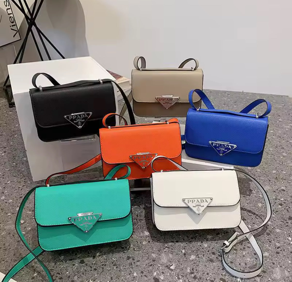 Small colorful crossbody flap bags with triangle logo snap closure