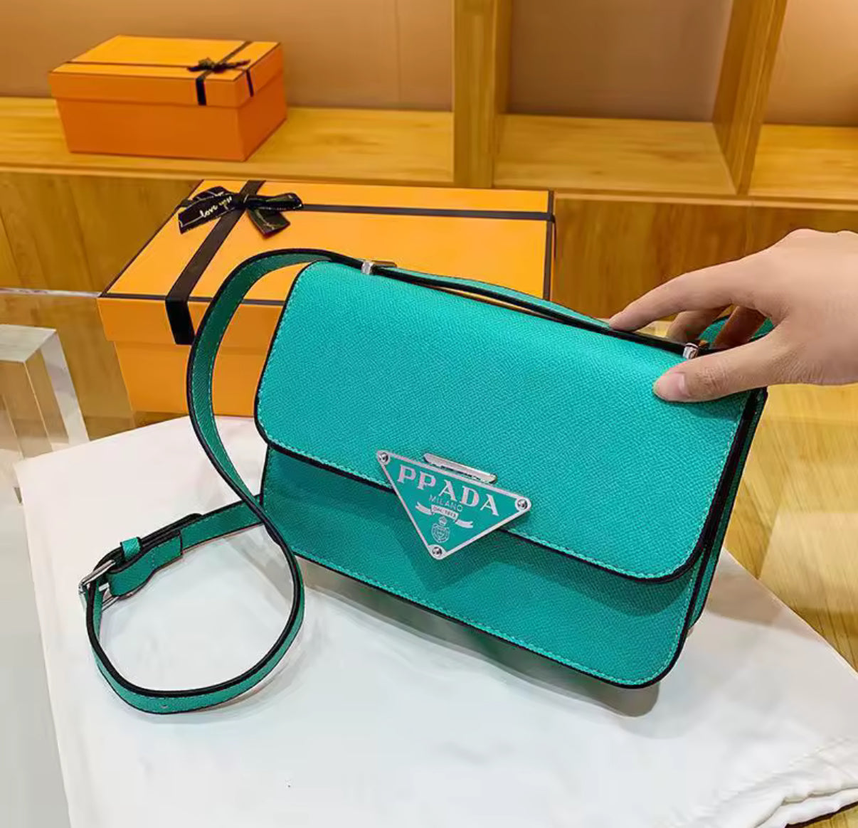 Small colorful crossbody flap bags with triangle logo snap closure