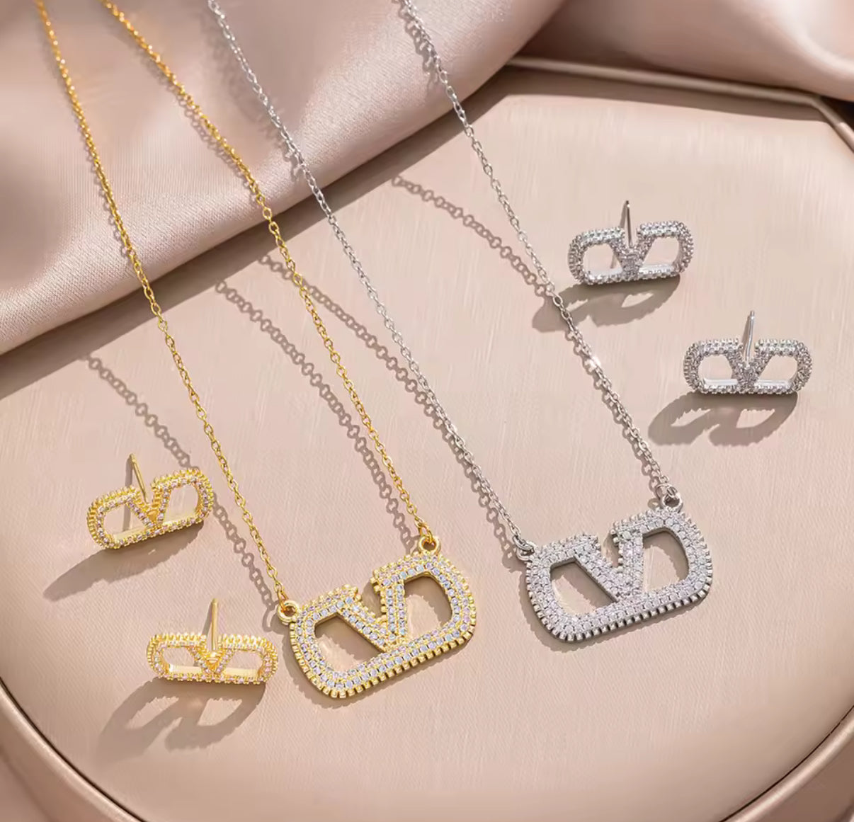 Assorted logo earrings and jewelry sets