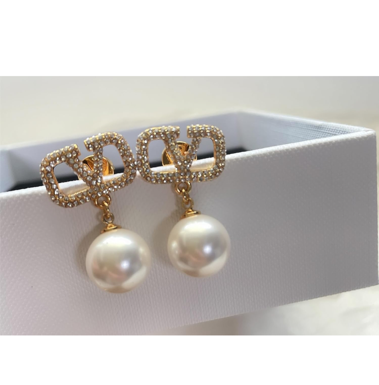 Assorted logo earrings and jewelry sets