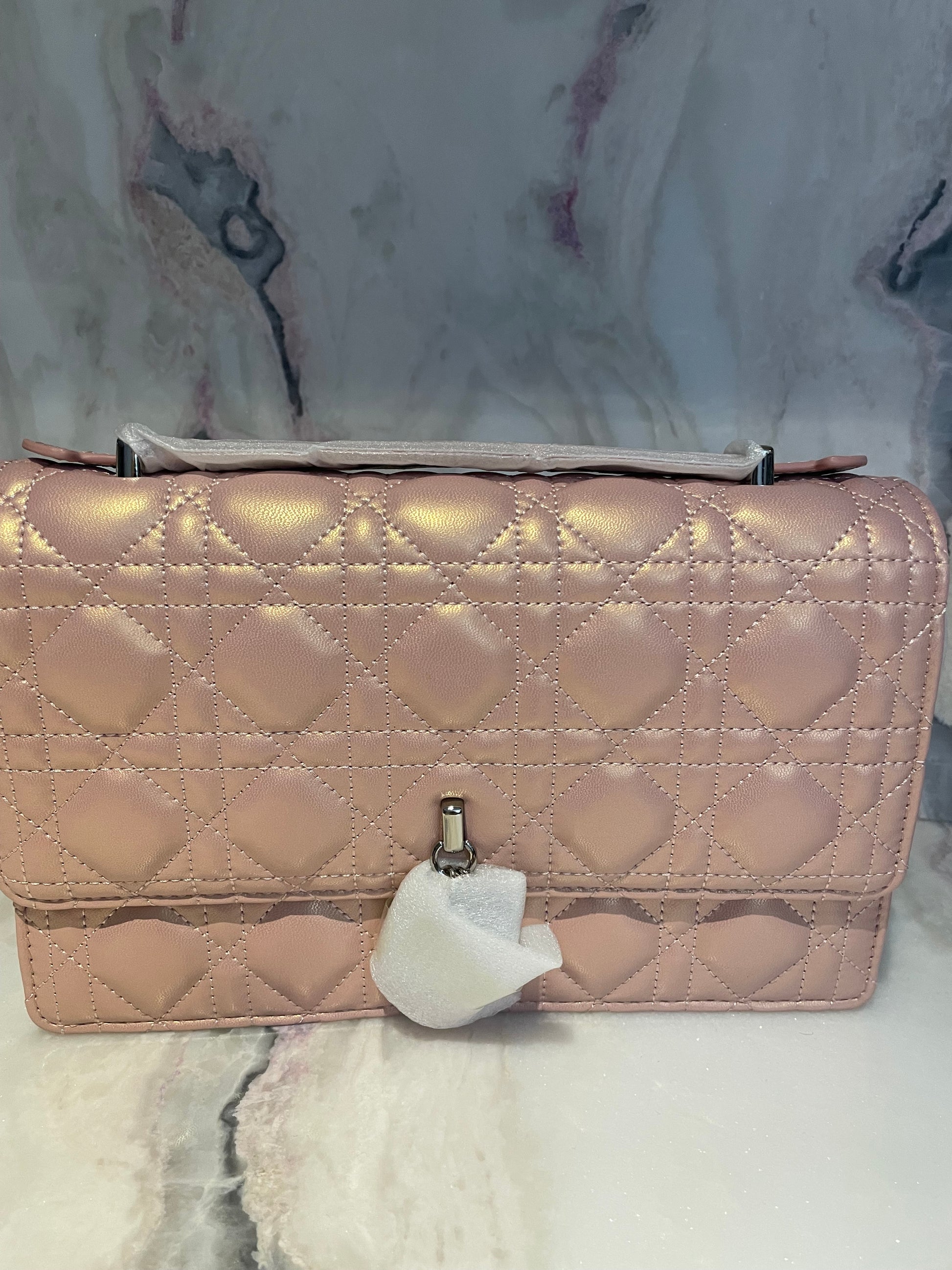 This is a photo of the actual pink crossbody bag that is on sale (in stock).