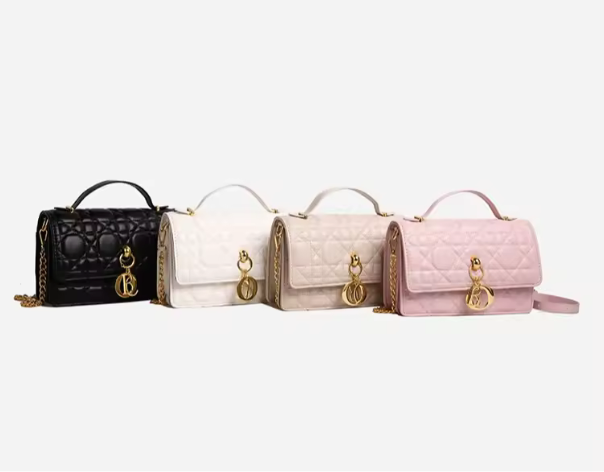 4 of the quilted leather crossbody bags with gold charms & gold chain straps,  each has a leather top handle.  
Black, white, tan, or pink (left to right colors shown) 