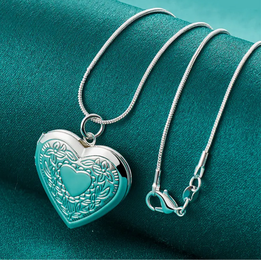 Gorgeous sterling silver S925 Heart shaped locket necklace. The heart locket opens and you can put a small item inside.  Most people put a small keepsake or photo inside. 