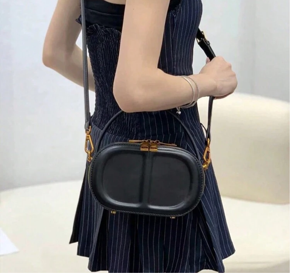 CD letter shapes cross body