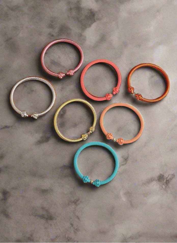 Various colored metal bangle bracelets