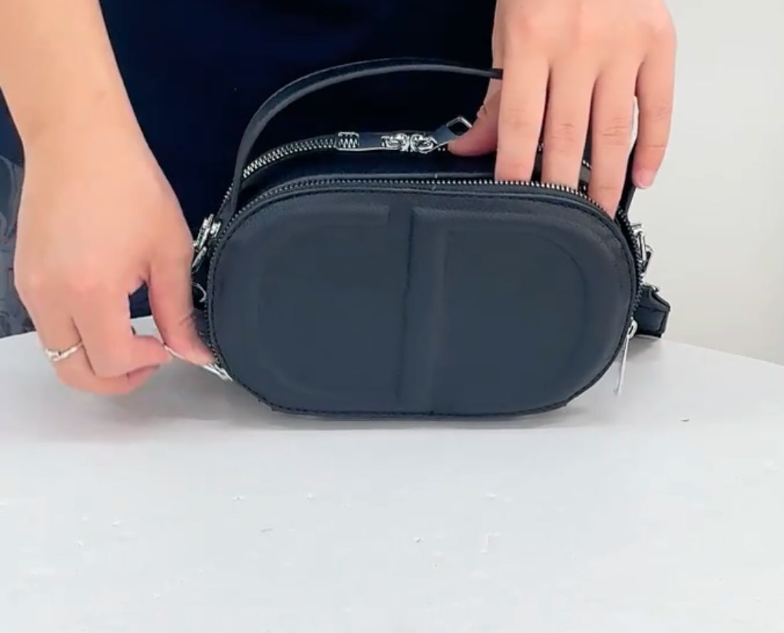 CD letter shapes cross body