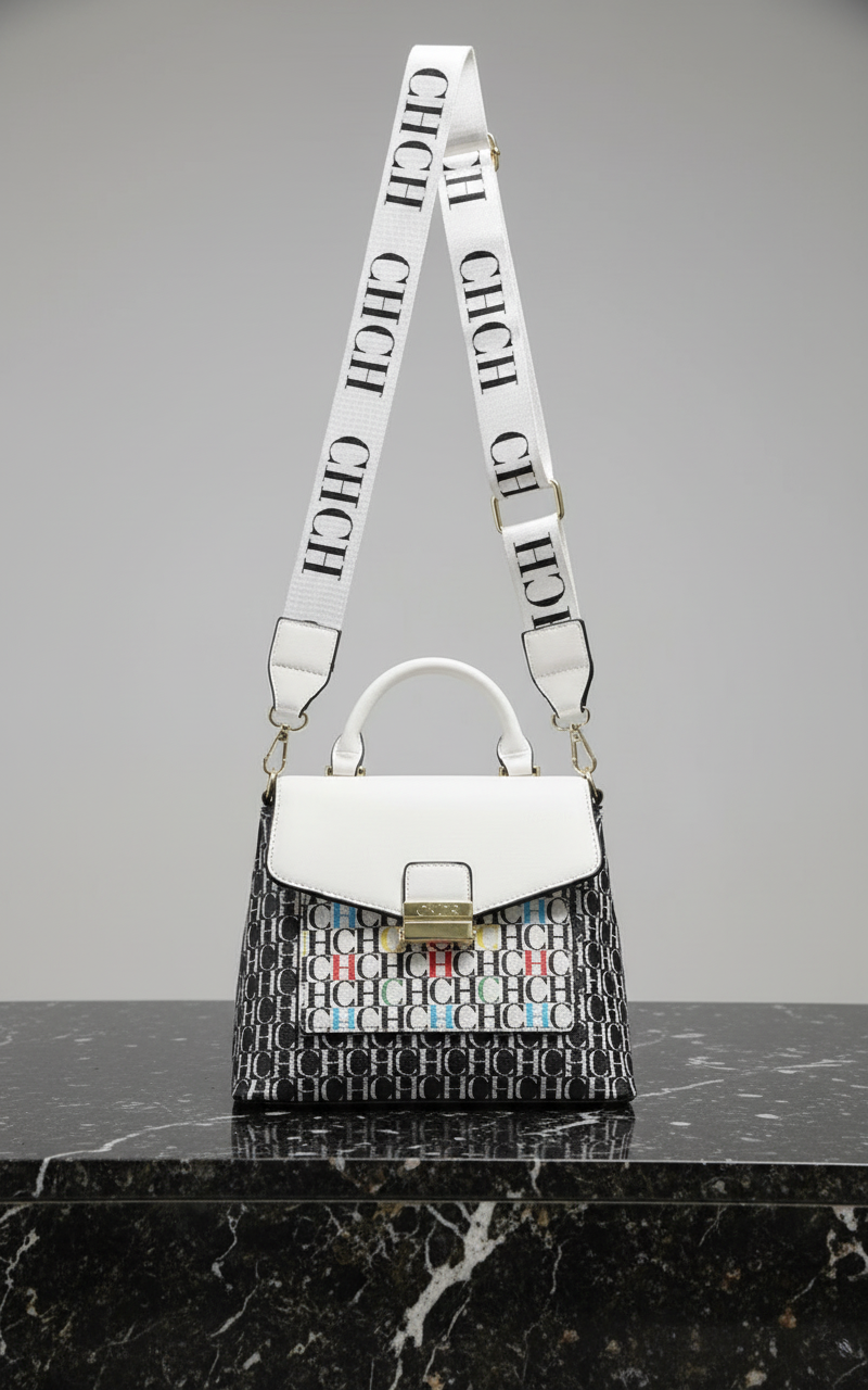 White handbag with a patterned strap on a white background