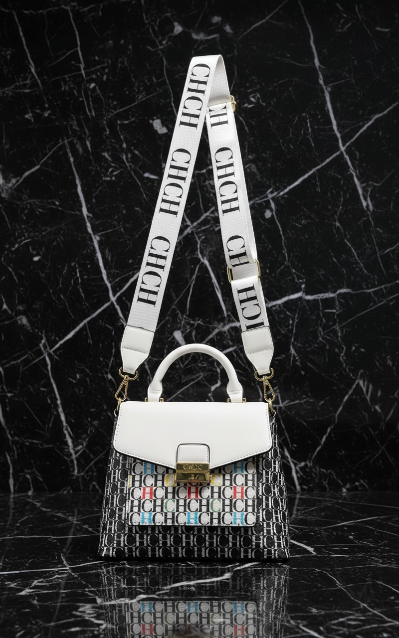 White & black CHCH lettered monogramed crossbody bag.  With long strap and colored letters in the pattern. Marble background.  Letter logo repeated throughout the sections of the bag and strap.  White leather flap top with snap and white leather handle.  