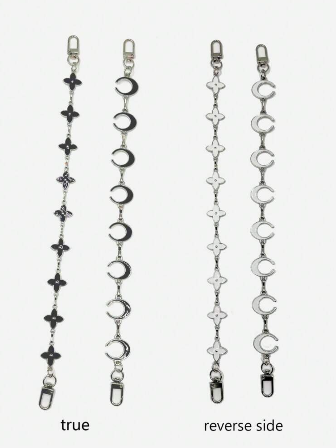 Both sides of the long moon and star bag strap extension chains in silver.  Each one is black on one side and white on the other.  The metal is silver in this option.    