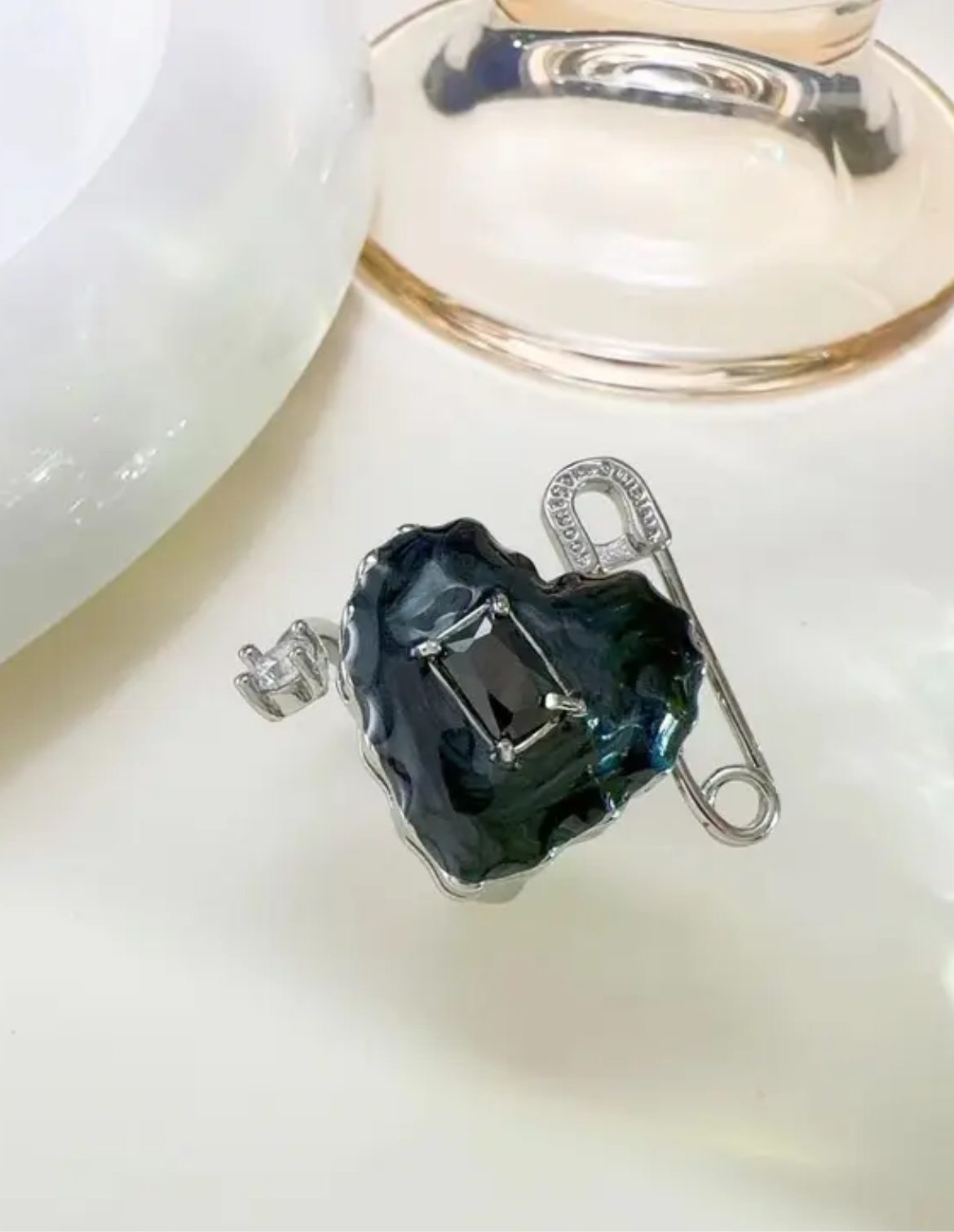 Black Heart VW sterling silver ring with safety-pin, gem, and name engraved details. 