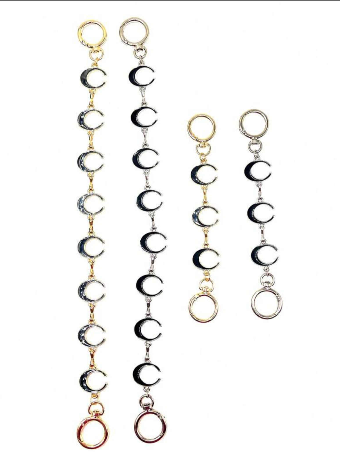 Both lengths of the “moon” bag chain extension chains shown in both gold and silver.  The moon shape is the letter C.  Each is double sided black & white.  