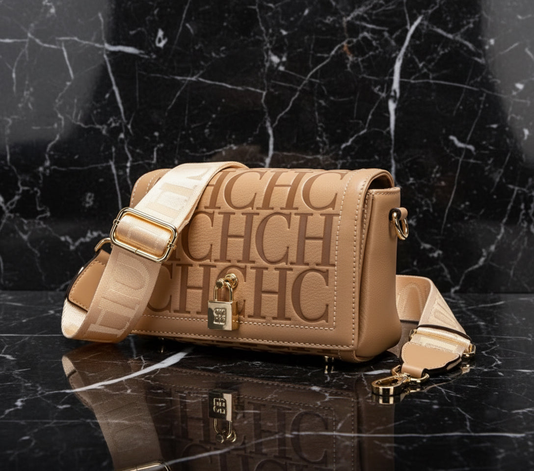 Beige handbag with 'CHIC' text and gold accents on a white background