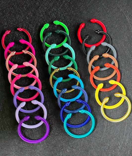 Various colored metal bangle bracelets
