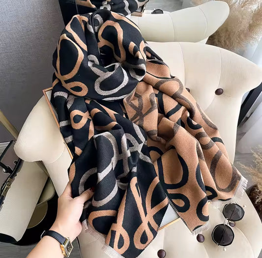 Orange & black Löwe scarf 🧣 with grey, black, brown & orange script L monogram. 
