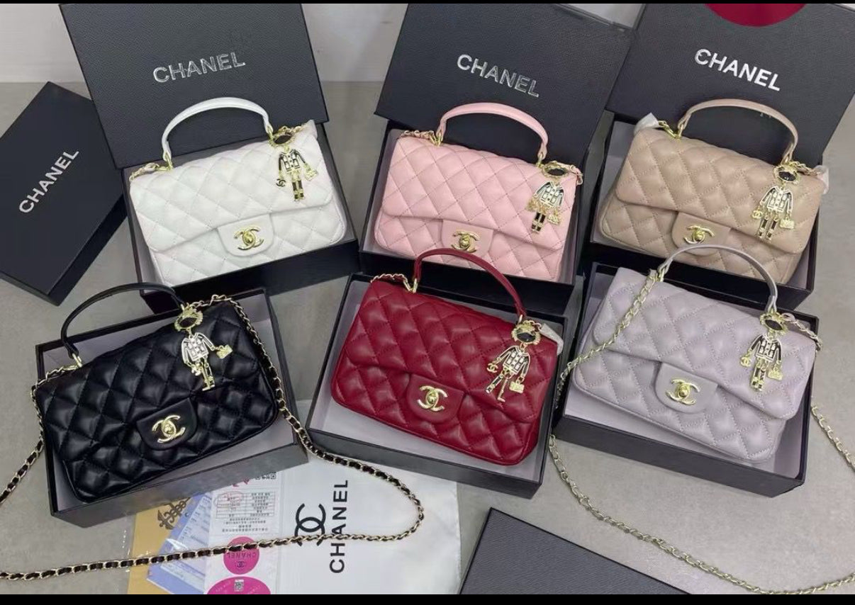 Top handle flap bag with cross body strap