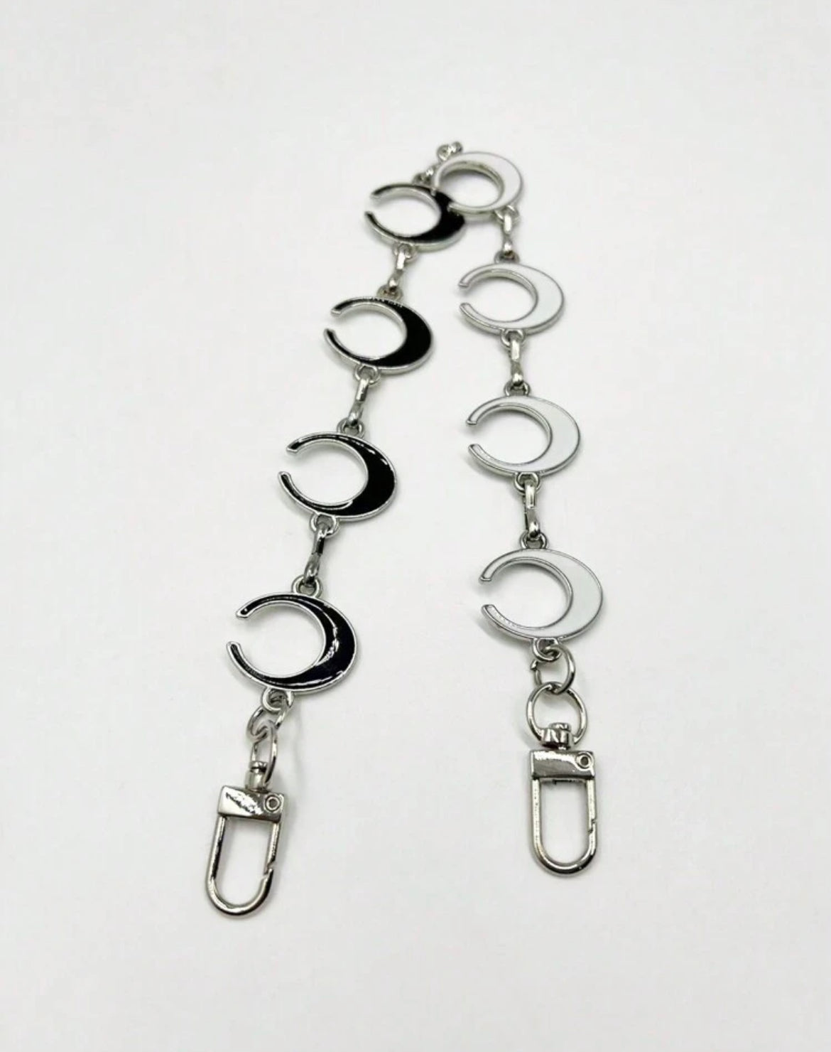 The silver long MOON chain.  These are reversible with black and white enamel on either side. 